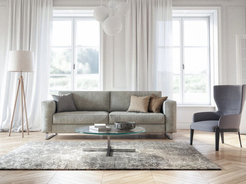 modern living room with sofa and rug in the middle of the area | Canyon Floor Corporation